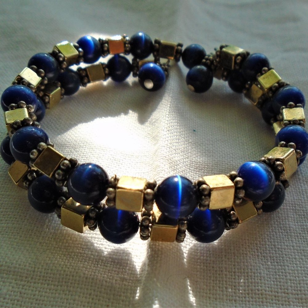 Gold and blue sapphire star bead coil bracelet